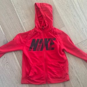 Red Nike zip up hoodie. Excellent condition. Kids large.